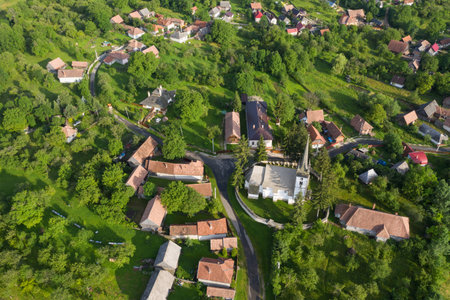 Aerial drone point of view of a whitewashed protestant church in Manastireni, Transylvania, Romaniaの写真素材