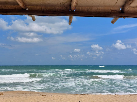 Beautiful sea view from a wooden sunshade beach canopy.の写真素材