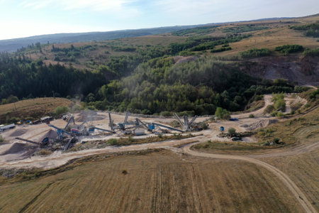 Aerial view of stone quarry conveyor belt system in operation, stone jaw crusher plantの写真素材