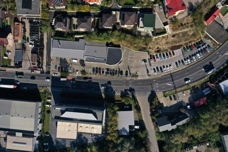 Aerial view of city traffic, cars driving on road by droneの写真素材