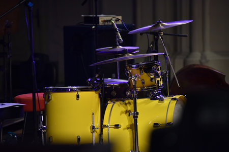 Yellow drum kit musical instrument on stageの写真素材