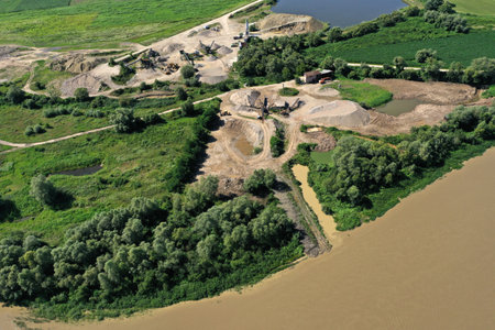 Aerial view of river sand and gravel exploitation, pit, quarry, ballast, ecological impact on environmentの写真素材