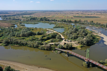 Aerial view of gravel pit mining reservoir and river, ballast, ecological impact on environment by droneの写真素材