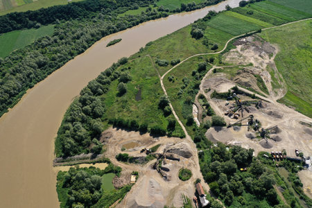 Aerial view of river sand and gravel exploitation, pit, quarry, ballast, ecological impact on environmentの写真素材