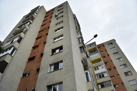 Perspective view of flat of blocks from Communist period, worn out concrete buildings in Eastern Europeの写真素材