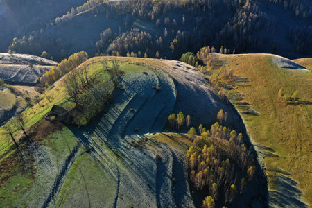 Aerial view of autumn countryside homestead and farmland by droneの写真素材