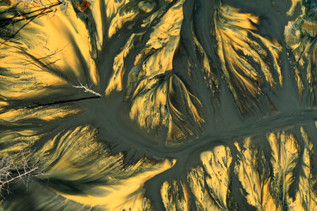 Patterns of acid mine drainage in decanting lake, nature pollution, aerial view by droneの写真素材