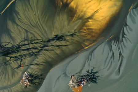 Patterns of acid mine drainage in decanting lake, nature pollution, aerial view by droneの写真素材