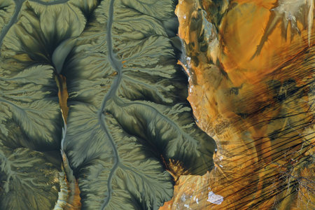 Patterns of acid mine drainage in decanting lake, nature pollution, aerial view by droneの写真素材