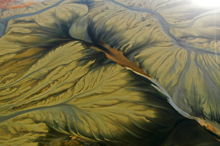 Aerial view of surreal natural patterns of gold cyanide leaching flowing into decanting lake by droneの写真素材
