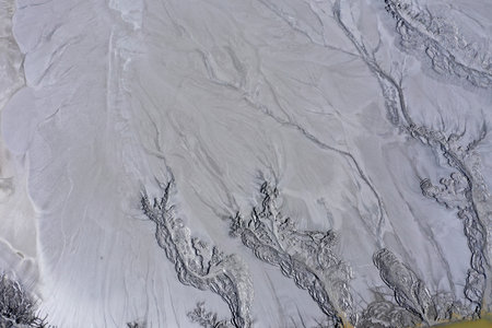 Abstract mud cracks and patterns aerial view by drone