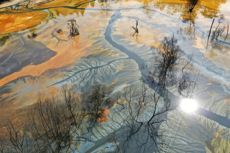 Aerial view of colorful contaminated cyanide residuals waters from gold mine. Abstract nature pattern by droneの写真素材