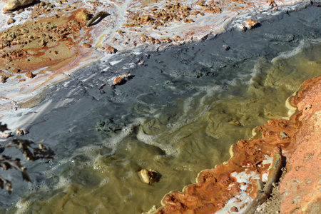 Toxic gold mining residual waters from gold mine flowing and polluting environment. Rosia Montana, Romaniaの写真素材