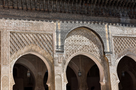 Carved stone gate arch, carved wooden archtectural details, Marinid architecture, Medersa bou...