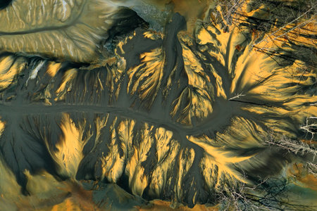 Ecological catastrophe nature pollution concept. Aerial view of abstract natural patterns. Acid mine drainage water background by droneの写真素材