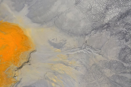 Ecological catastrophe nature pollution concept. Aerial view of abstract natural patterns. Acid mine drainage water background by droneの写真素材