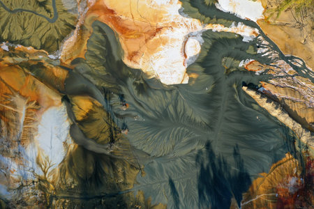 Ecological catastrophe nature pollution concept. Aerial view of abstract natural patterns. Acid mine drainage water background by droneの写真素材