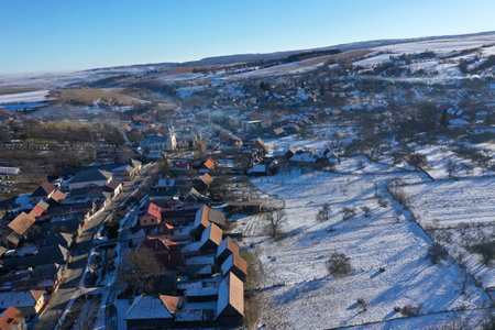 Aerial view of mountain village at winter by drone. Manastireni, Romaniaの写真素材