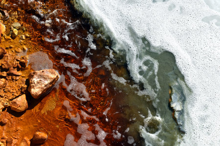 Acidic mine residual water drainage, flowing into decanting pond. Rosia Montana, Romaniaの写真素材