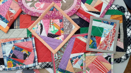 Colorful handmade textiles. Colored fabric patchwork background. Patchwork background. Multicolored...