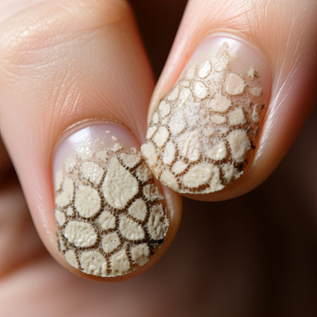 Close-up of a woman s nails showcasing reptilian-inspired nail art. This trendy manicure detail highlights a creative style, perfect for beauty and lifestyle enthusiasts.の素材