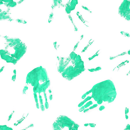 A striking pattern of handprints on a white background, creating a bold and dramatic visual effect.の写真素材
