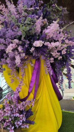 Experience elegance with a stunning display of lavender blooms draped over soft yellow fabric, perfect for weddings, events, or any project needing a touch of floral sophistication.の写真素材