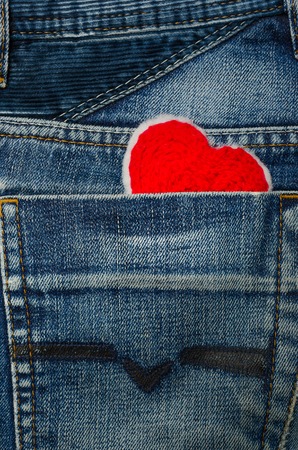 Red heart in the pocket of his jeans to design for the holiday of Valentine's Dayの写真素材