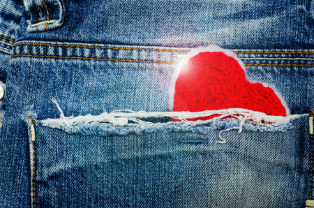 Red heart in jean pocketの写真素材