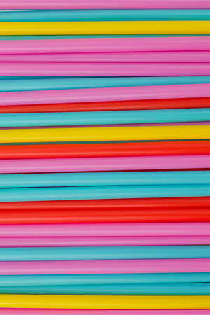 Abstract background from many multi-color straws. verticalの写真素材
