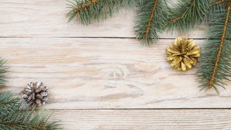 Christmas gifts, fir tree branches on white wooden background. Flat lay, frame. Christmas...