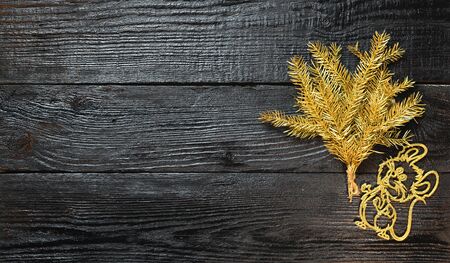 Festive Christmas card 2020 In the year of the white rat. With fir branches and a mouse on a wooden background. The view from the topの写真素材