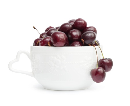Cherry in white bowl isolated on white backgroundの写真素材