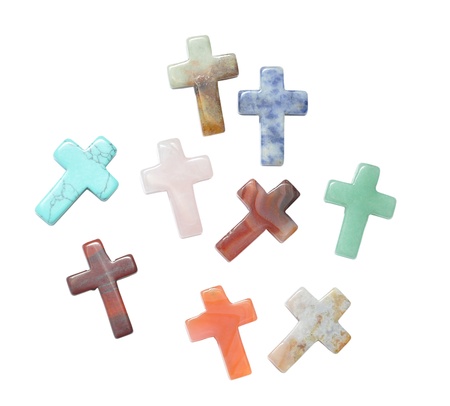 Crosses made of semi precious stones isolated on white background