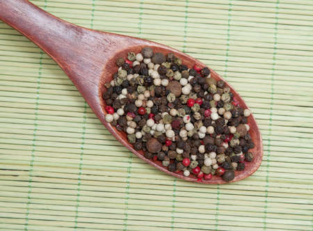 pepper in wooden spoon