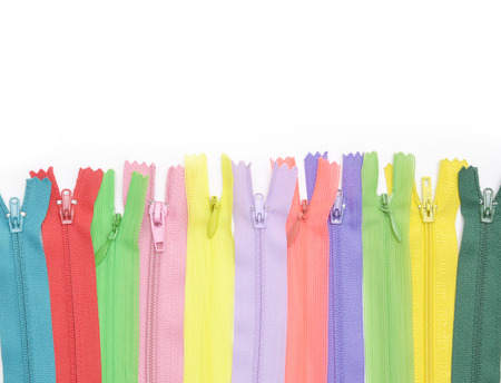 Multicolored zipper lined in a rowの写真素材