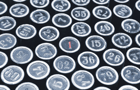 A random group of numbers photographed using vintage type. A series of letterpress backgrounds. With an emphasis on the figure of oneの写真素材