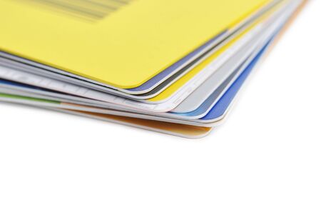 Stack of credit cards on white background