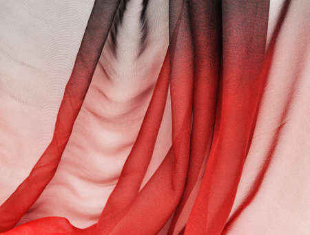 Abstract black-red soft chiffon texture background. Macro with extremely shallow dof.の写真素材