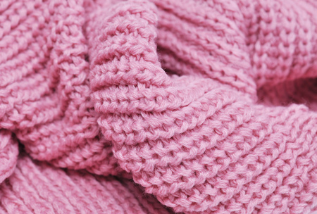 Handmade pink knitting wool texture background. Macro with extremely shallow dof.の写真素材