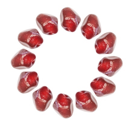Ripe pomegranate fruit isolated on whlte. Arranged in a circleの写真素材