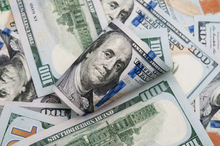 Dollars rolled close up. One Hundred Dollar Banknotes.の写真素材