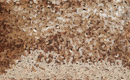 Gold disco glitter reflective fabric sparkling background