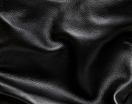 Black leather background. Macro with extremely shallow dof.