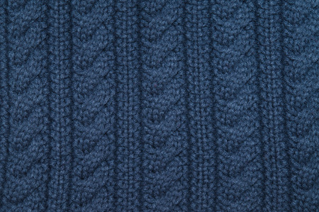 Handmade blue knitting wool texture background.