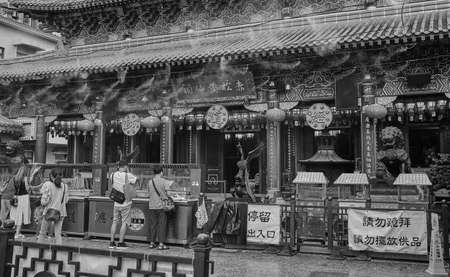 People praying at Wong Tai Sin Temple, Wong Tai Sin Temple is a well known shrine and tourist attraction in Hong Kong.のeditorial素材