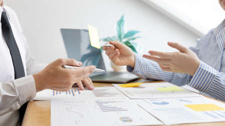 Business team meeting, Marketers and financial accountants are discussing and analyzing charts to plan strategies to meet customer needs, Brainstorming and business discussions.の写真素材