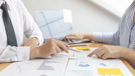 Business team meeting, Marketers and financial accountants are discussing and analyzing charts to plan strategies to meet customer needs, Brainstorming and business discussions.の写真素材