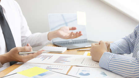 Business team meeting, Marketers and financial accountants are discussing and analyzing charts to plan strategies to meet customer needs, Brainstorming and business discussions.の写真素材