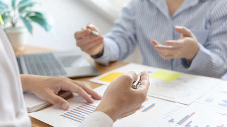Business team meeting, Marketers and financial accountants are discussing and analyzing charts to plan strategies to meet customer needs, Brainstorming and business discussions.の写真素材